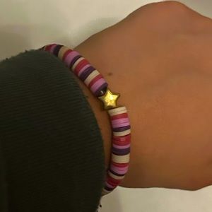 Clay Bead, Pink,Purple, and White with a Gold Star